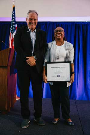 Estella Dennard receives her 30 Years of Service award.